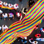 People marching with colorful banner
