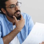 HR manager reading verification of vaccination report