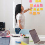 Team of employees collaborating during in-person meeting
