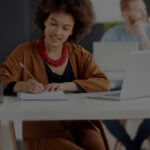 Employee on laptop researching HR and compliance related posts on the Mineral blog