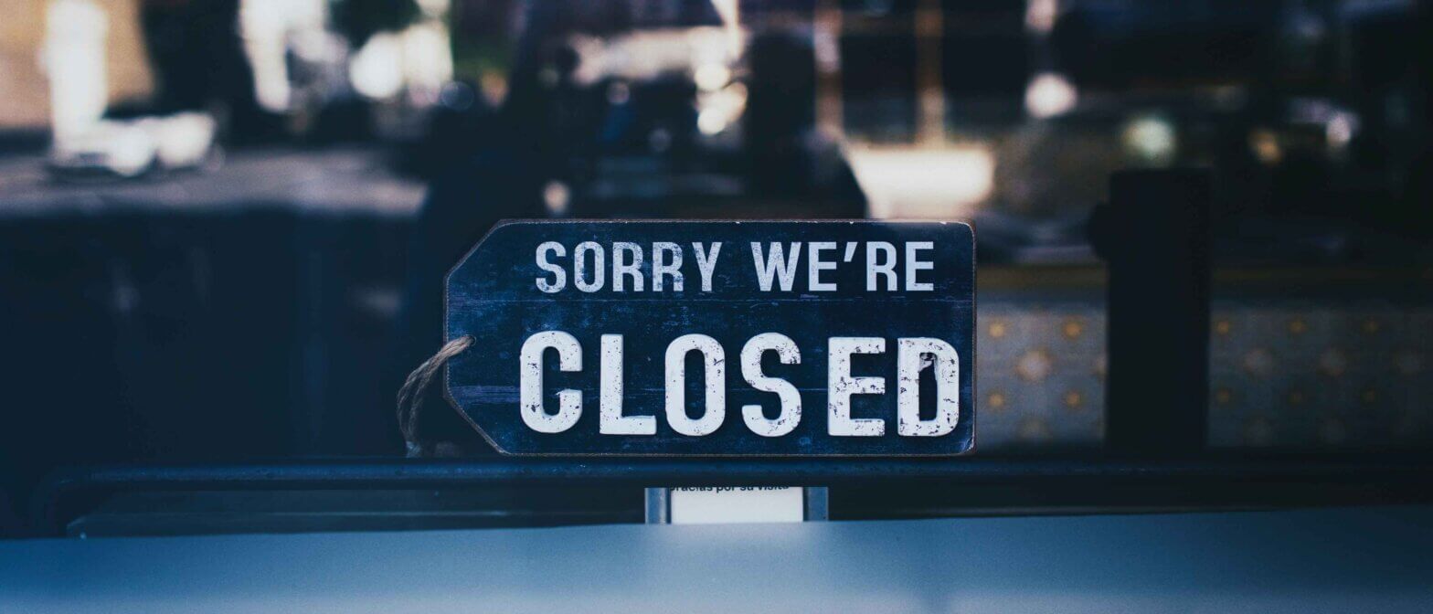 Sign that says "sorry we're closed"