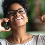 Woman on phone celebrating