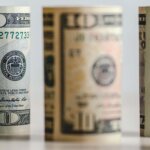 Rolled dollar bills with distance blur